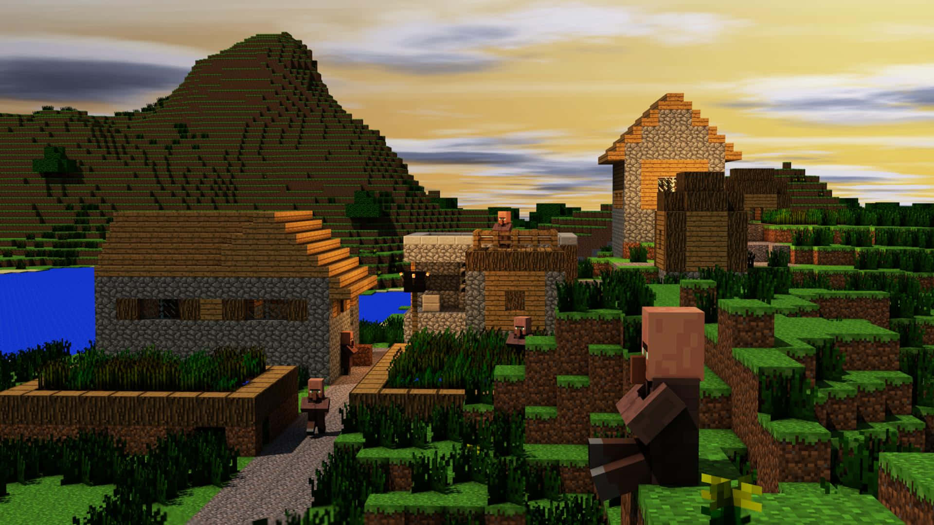 A picturesque Minecraft village nestled in a lush green landscape Wallpaper