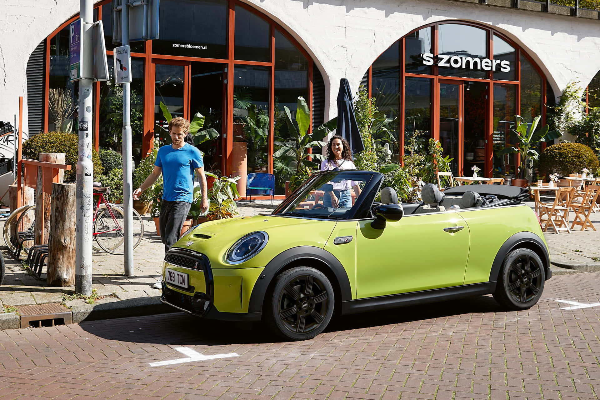 Enjoy the thrill of open-top driving with the Mini Cooper Convertible Wallpaper