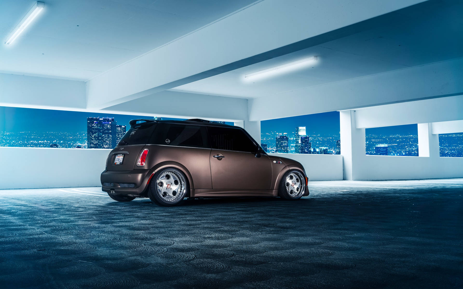 Mini Cooper In Elevated Parking Space Wallpaper