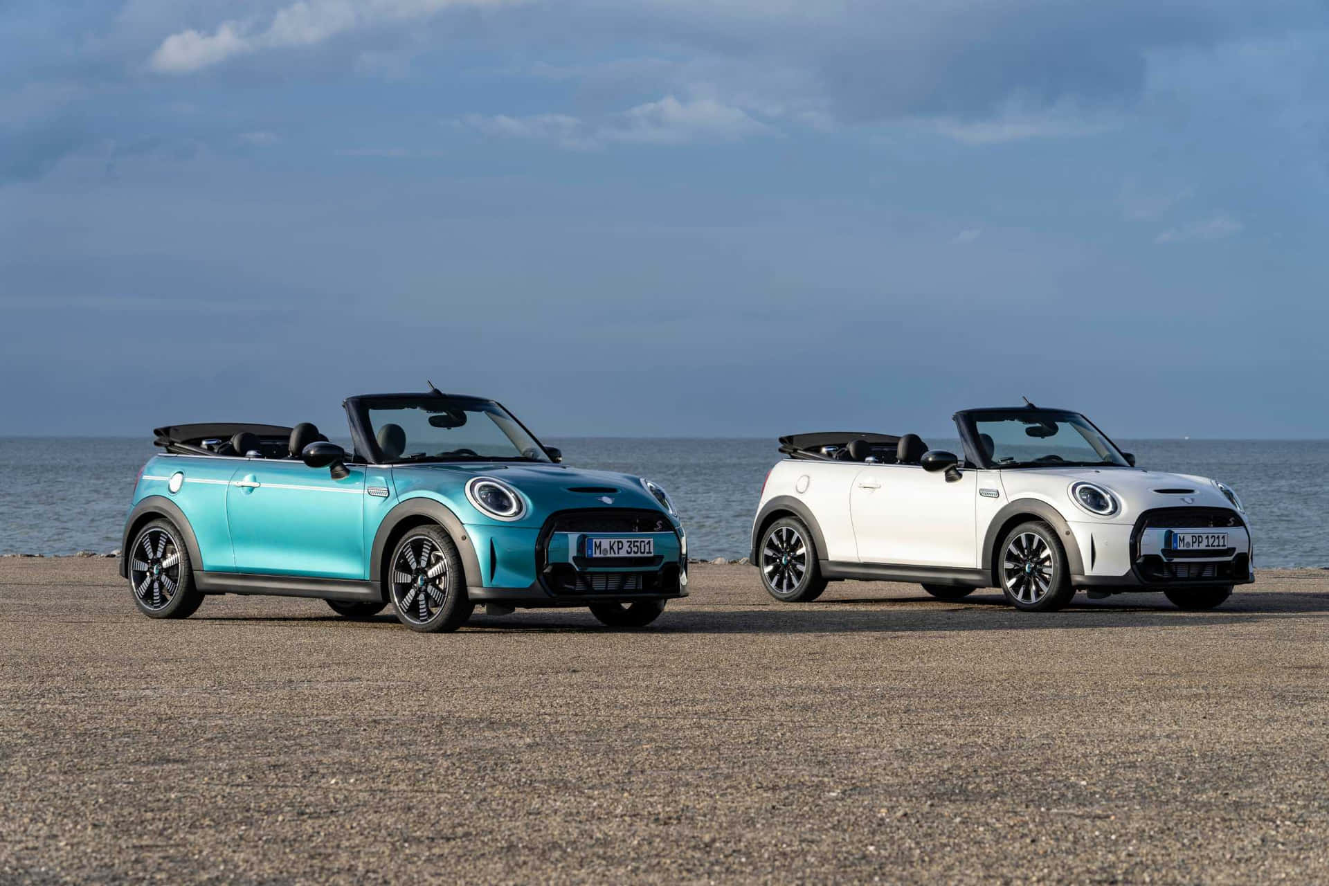 Caption: Stylish Mini Cooper S Convertible on an open road Wallpaper