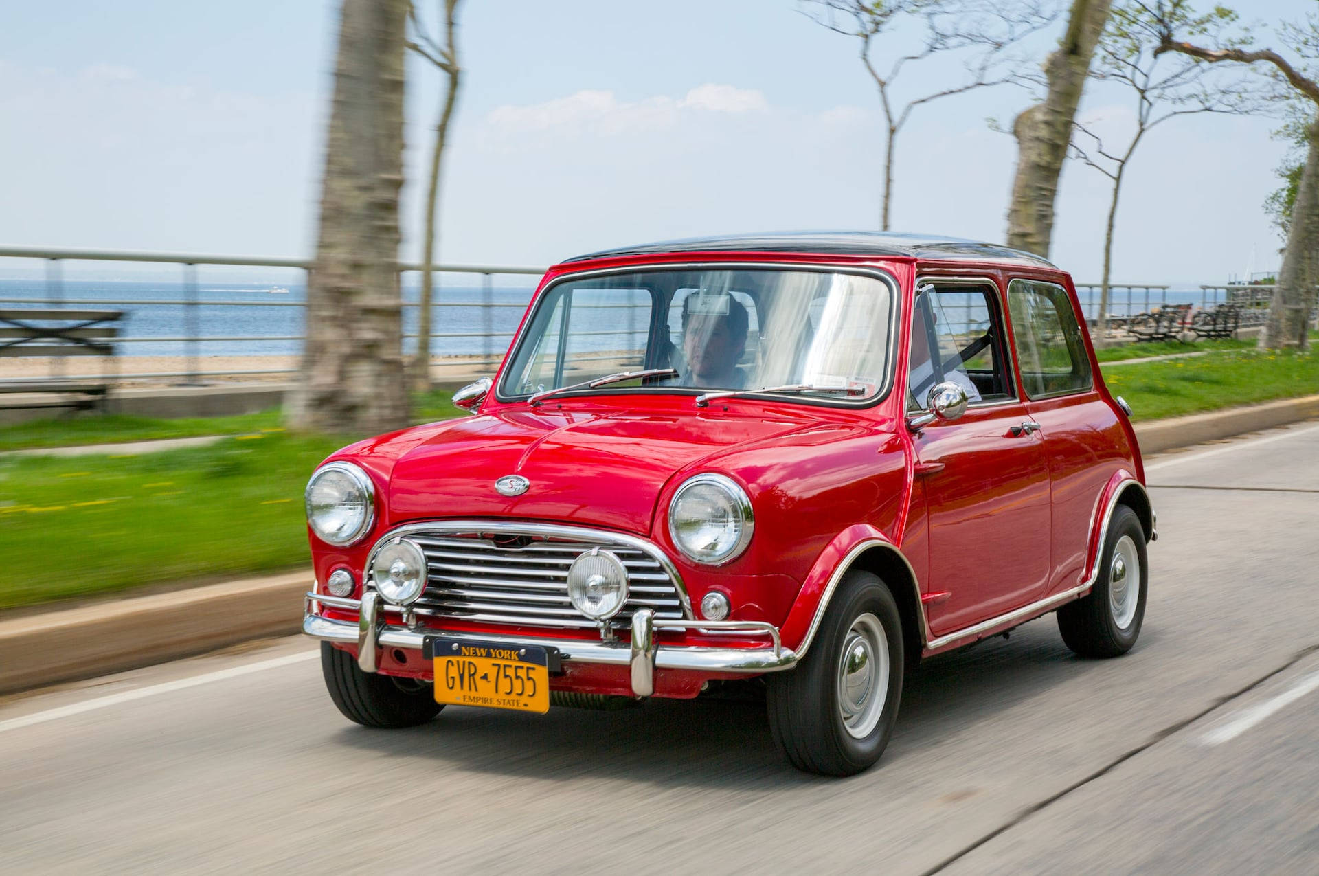 Mini Red Aesthetic Driving On Road Wallpaper