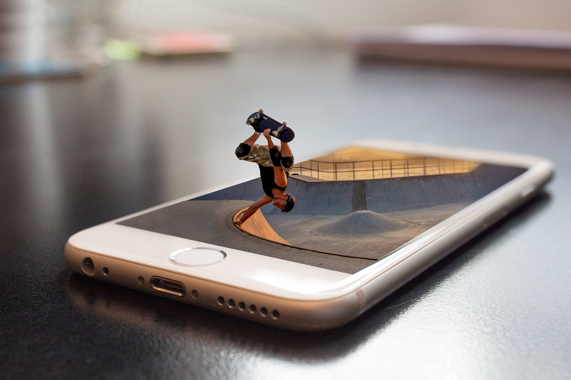 Mini Skateboarder On Mobile Phone Background