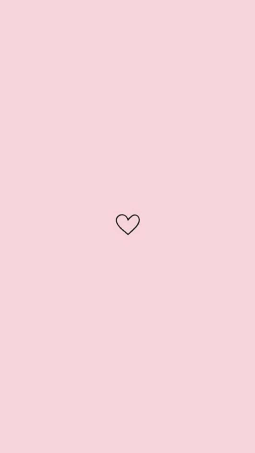 Download A Pink Background With A Heart On It | Wallpapers.com