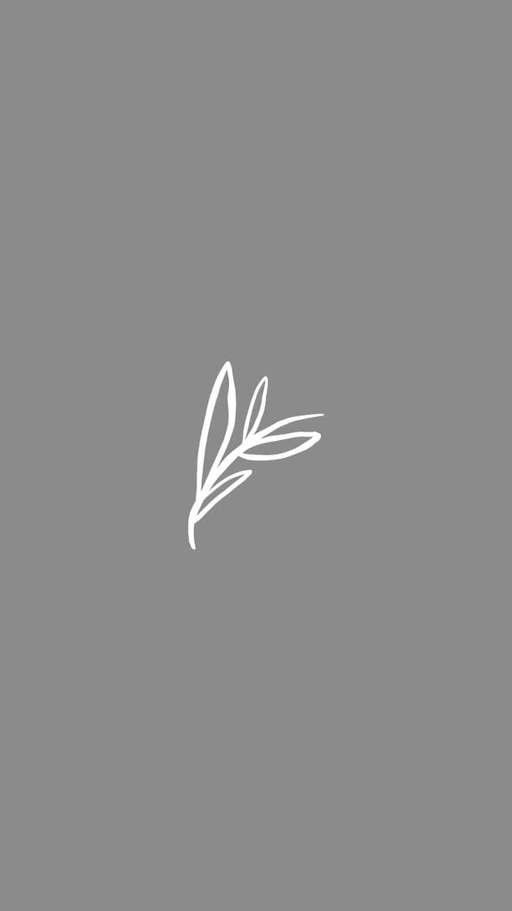 A White Leaf Logo On A Gray Background Wallpaper