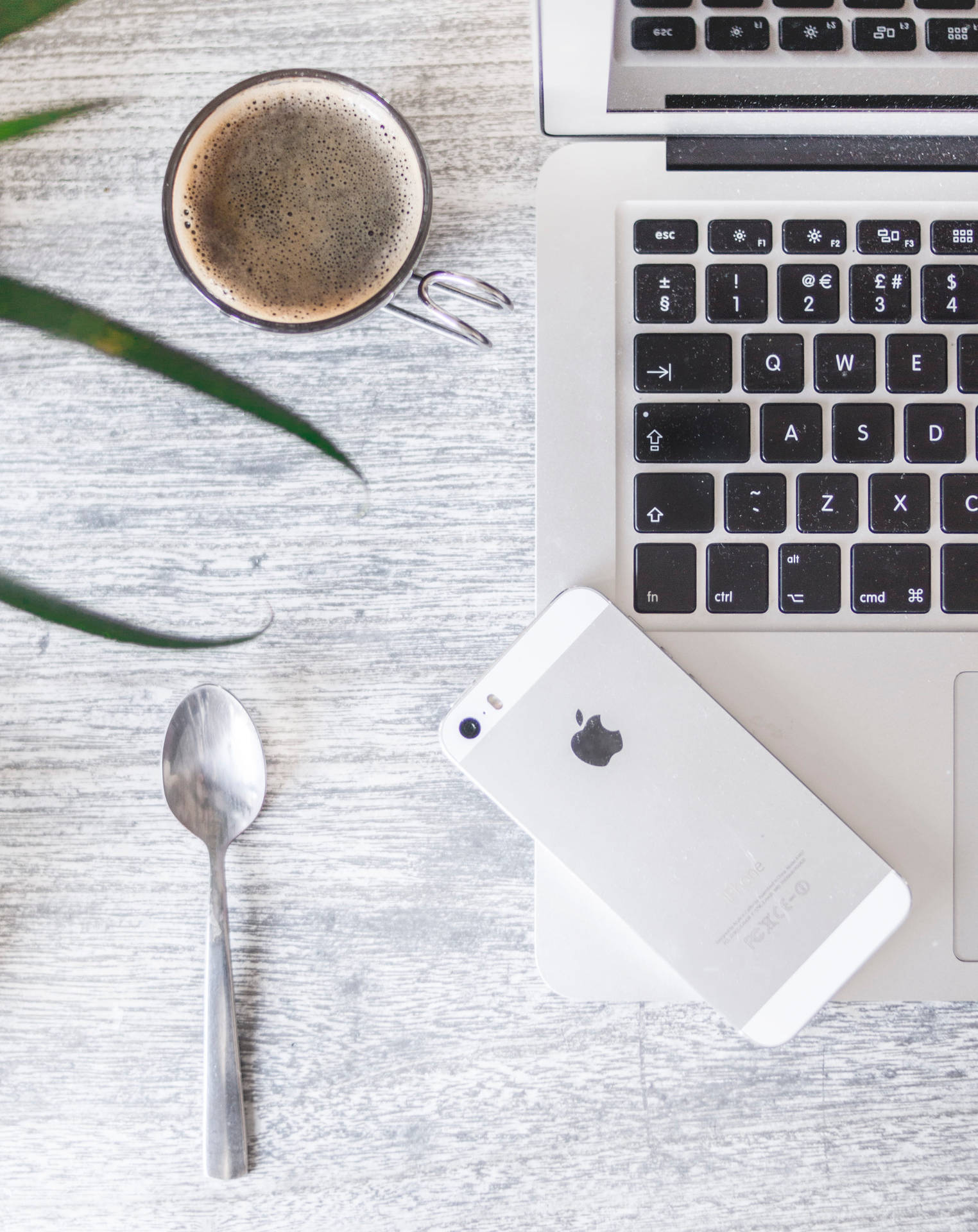 Minimalist Iphone Desk With Silver Spoon Wallpaper