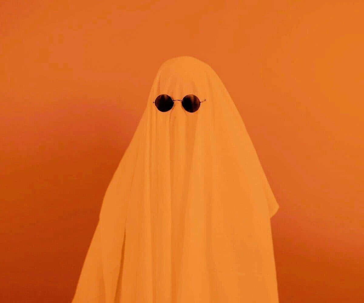 Minimalist Orange Ghost Costume Wallpaper