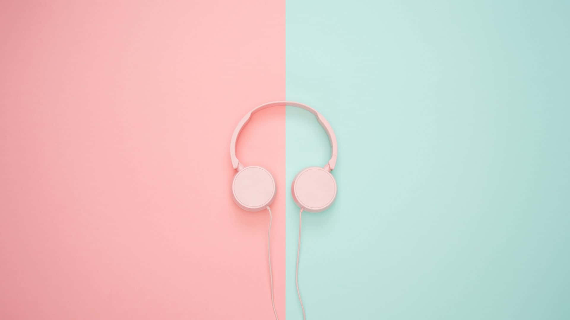 rosa hovedtelefoner på en pink og blå baggrund Wallpaper