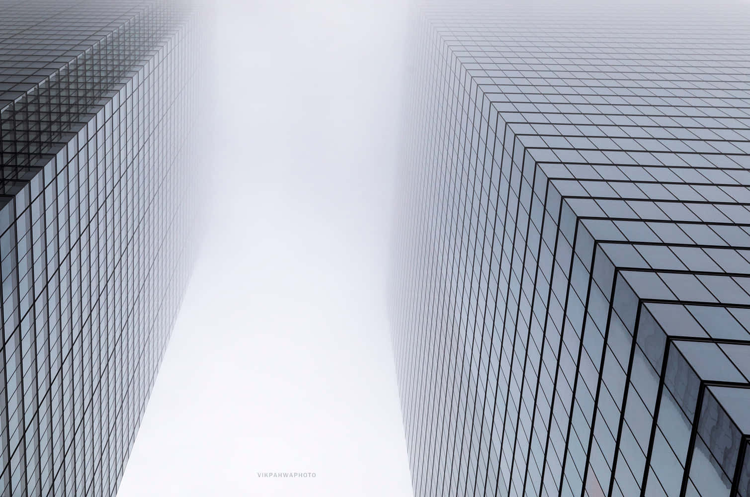 Two Tall Buildings In The Fog