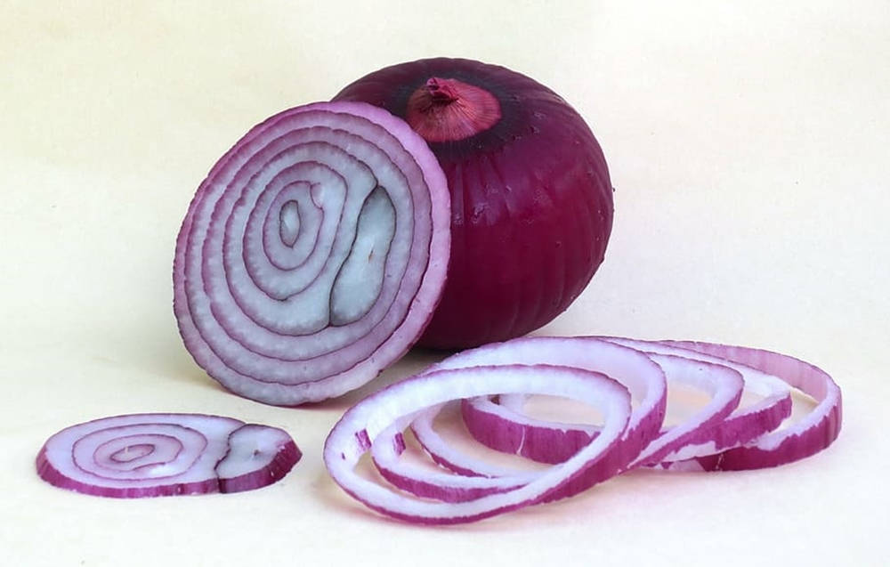 Minimalistic Chopped Red Onion Rings Wallpaper