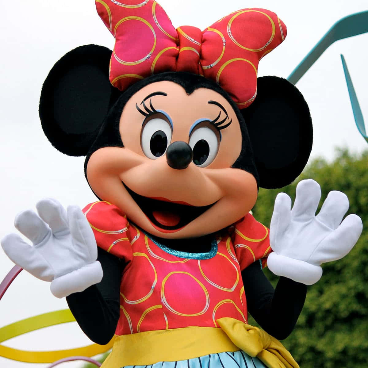 Minnie Mouse looking bubbly in her iconic red and white dress