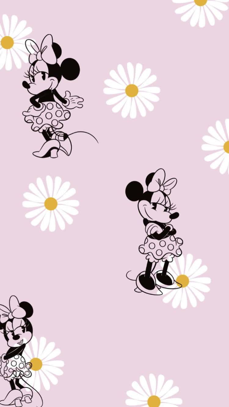 Playful Minnie Mouse In Her Favorite Color Pink Wallpaper