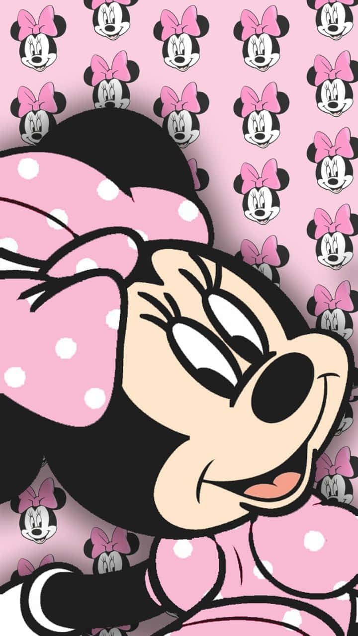 Hakul Med Minnie Mouse, Klädd I Sina Signaturfärger På Din Dataskärm Eller Mobilskärm. Wallpaper