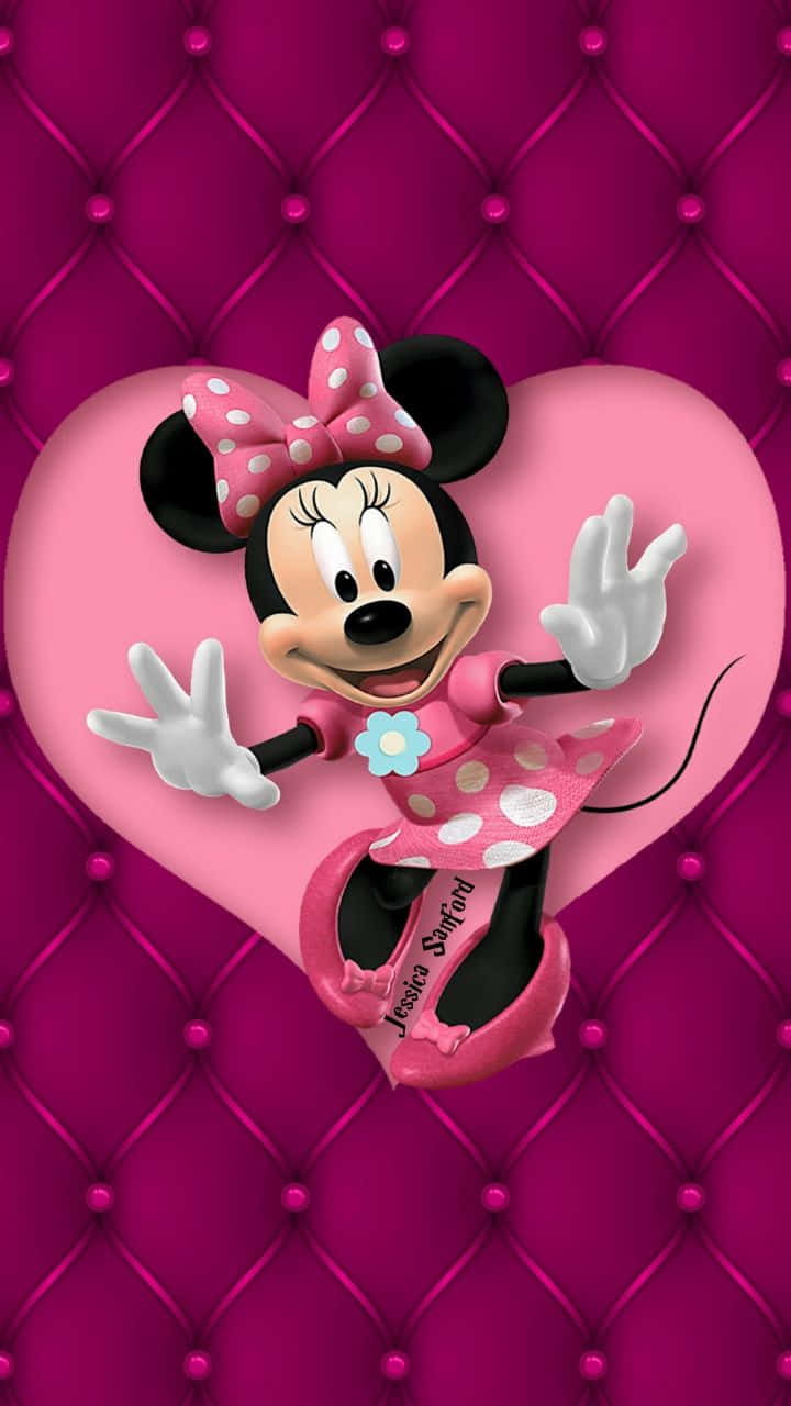 Minnie Mouse In Her Classic Pink Outfit. Wallpaper