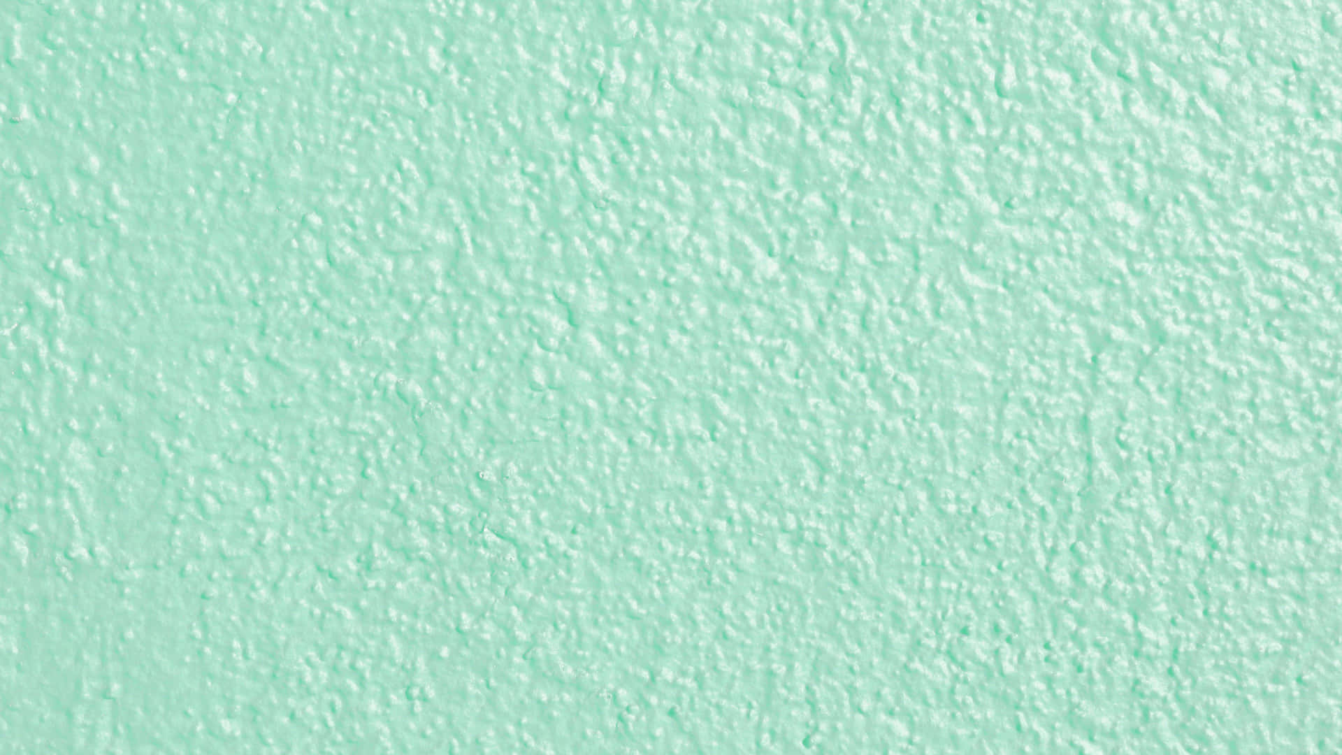 A Close Up Of A Mint Colored Wall