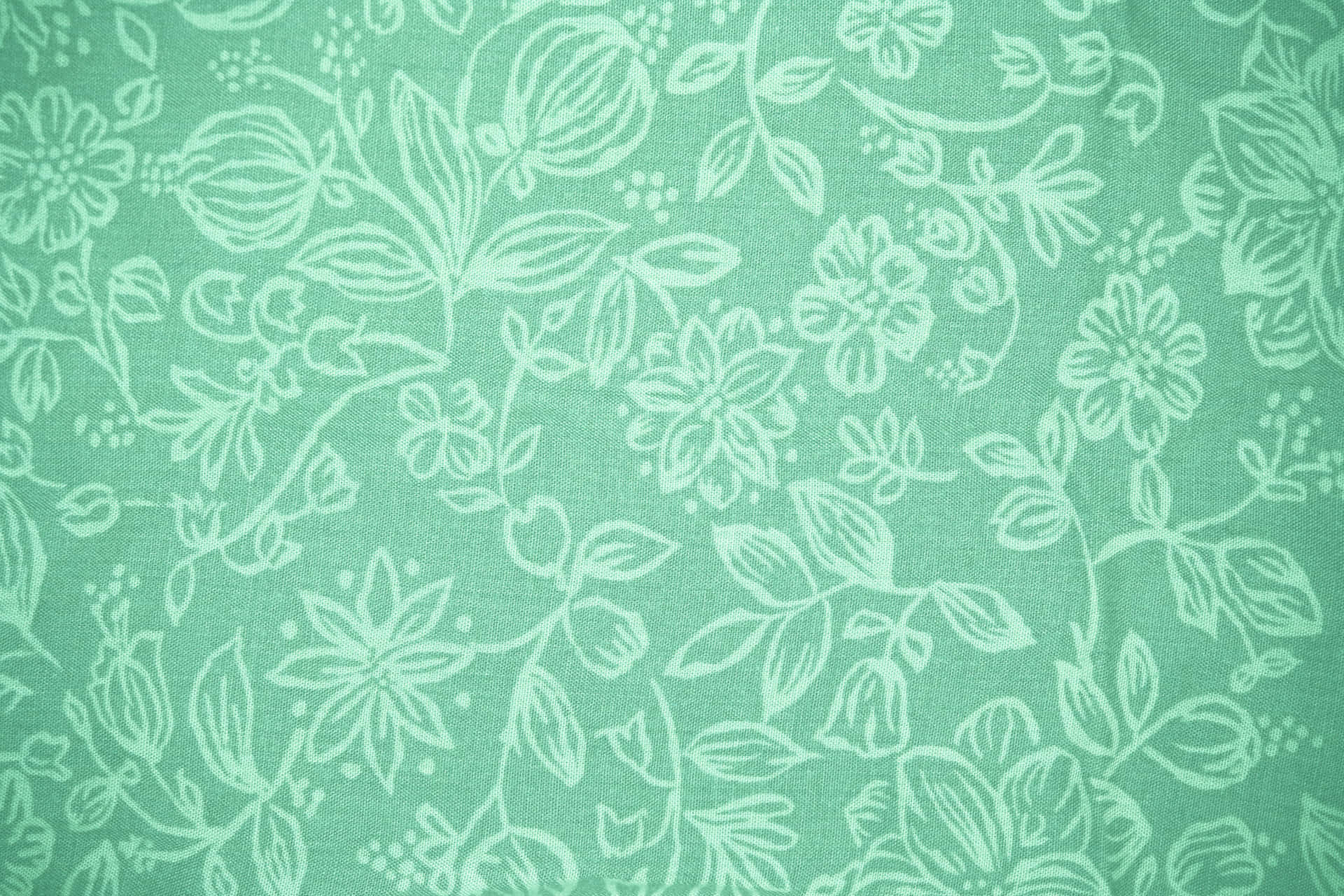 A Green Floral Fabric With White Flowers