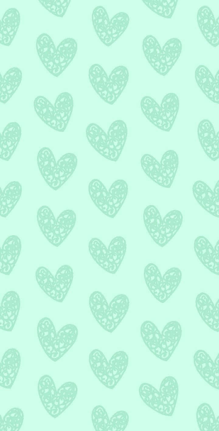 A Green Background With Hearts On It Wallpaper