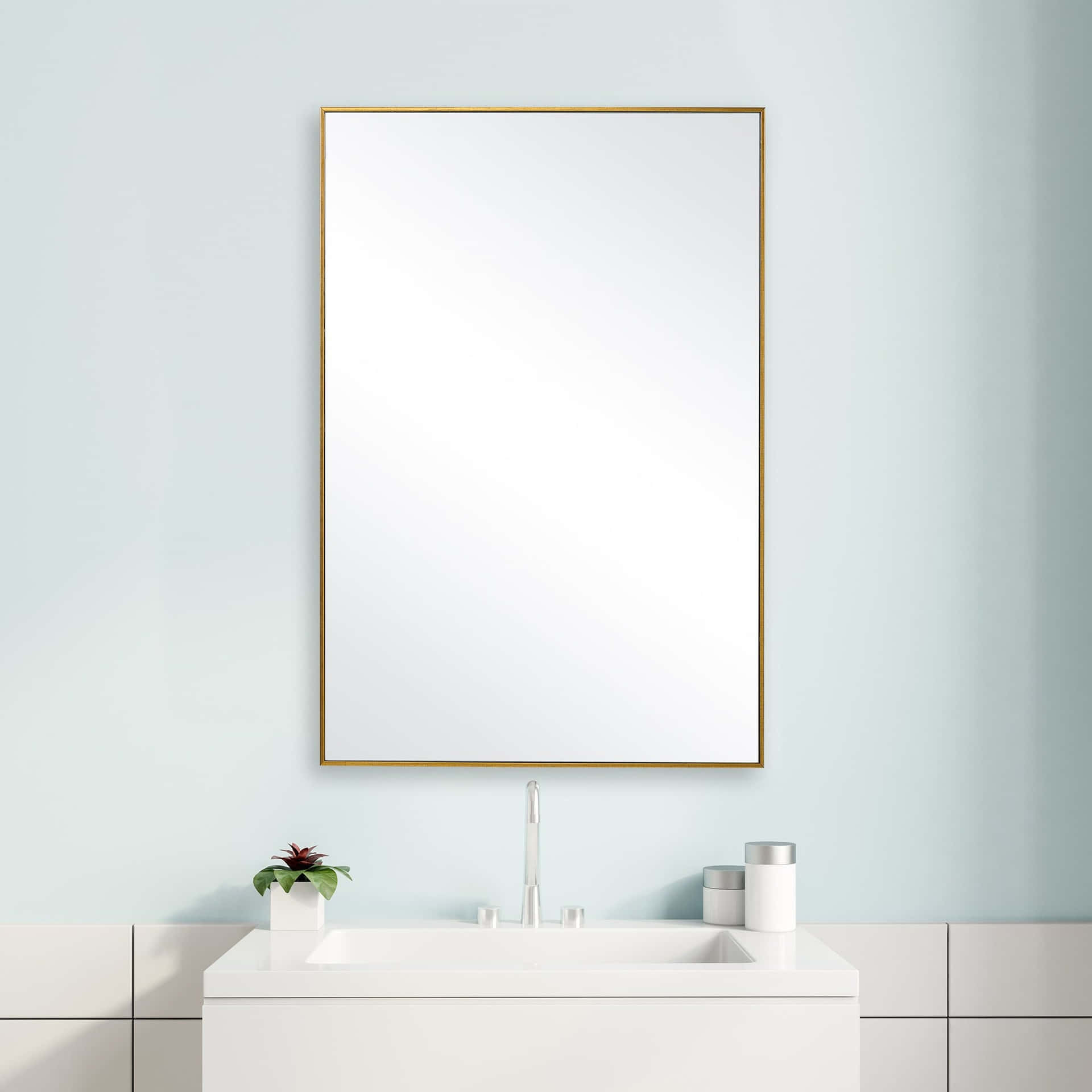 A Bathroom With A White Sink And A Gold Mirror