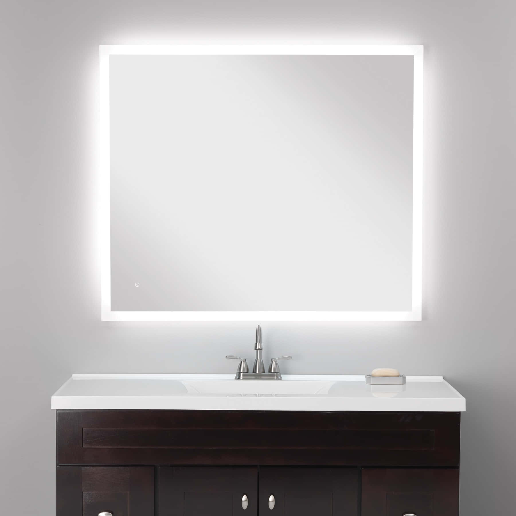 A Bathroom Vanity With A Mirror Above It
