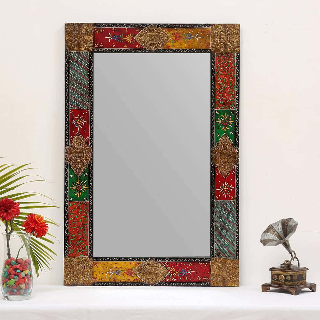A Colorful Mirror With A Flower And Vase