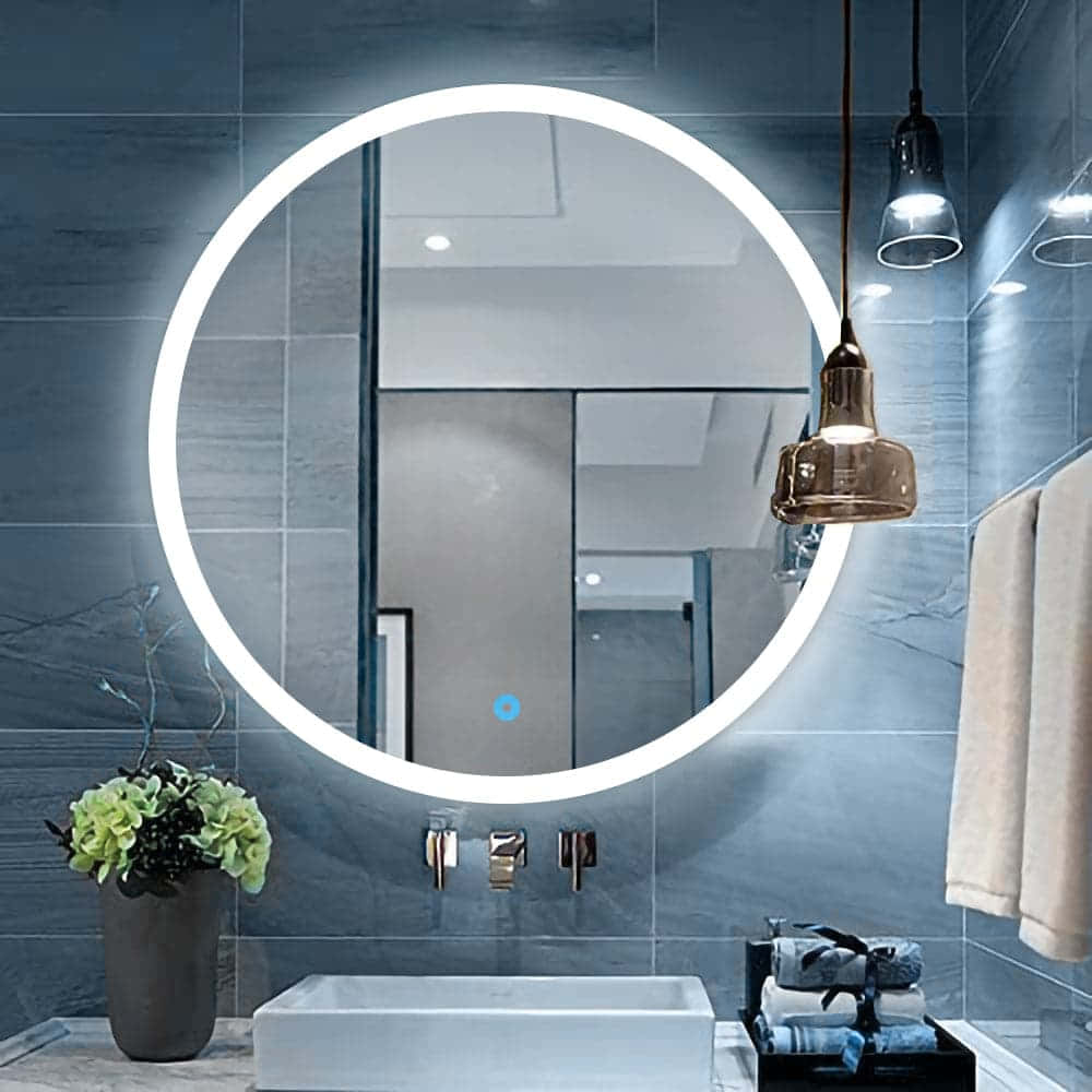 A Bathroom With A Circular Mirror And Sink