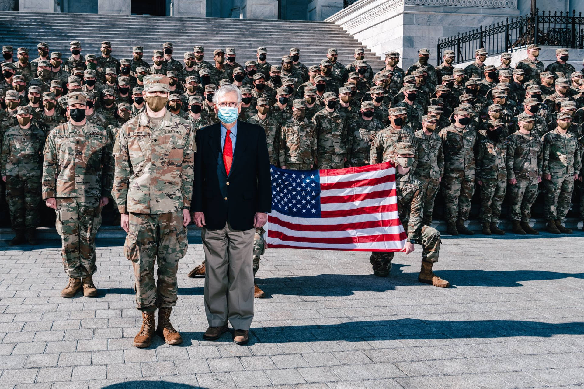 Mitch Mcconnell And Soldiers At Attention Wallpaper