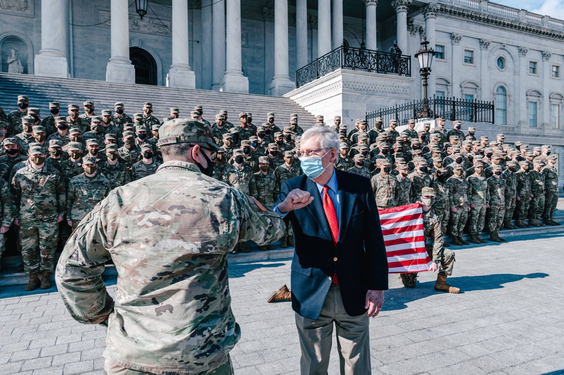 Mitch Mcconnell Elbow-bumping A Soldier Wallpaper