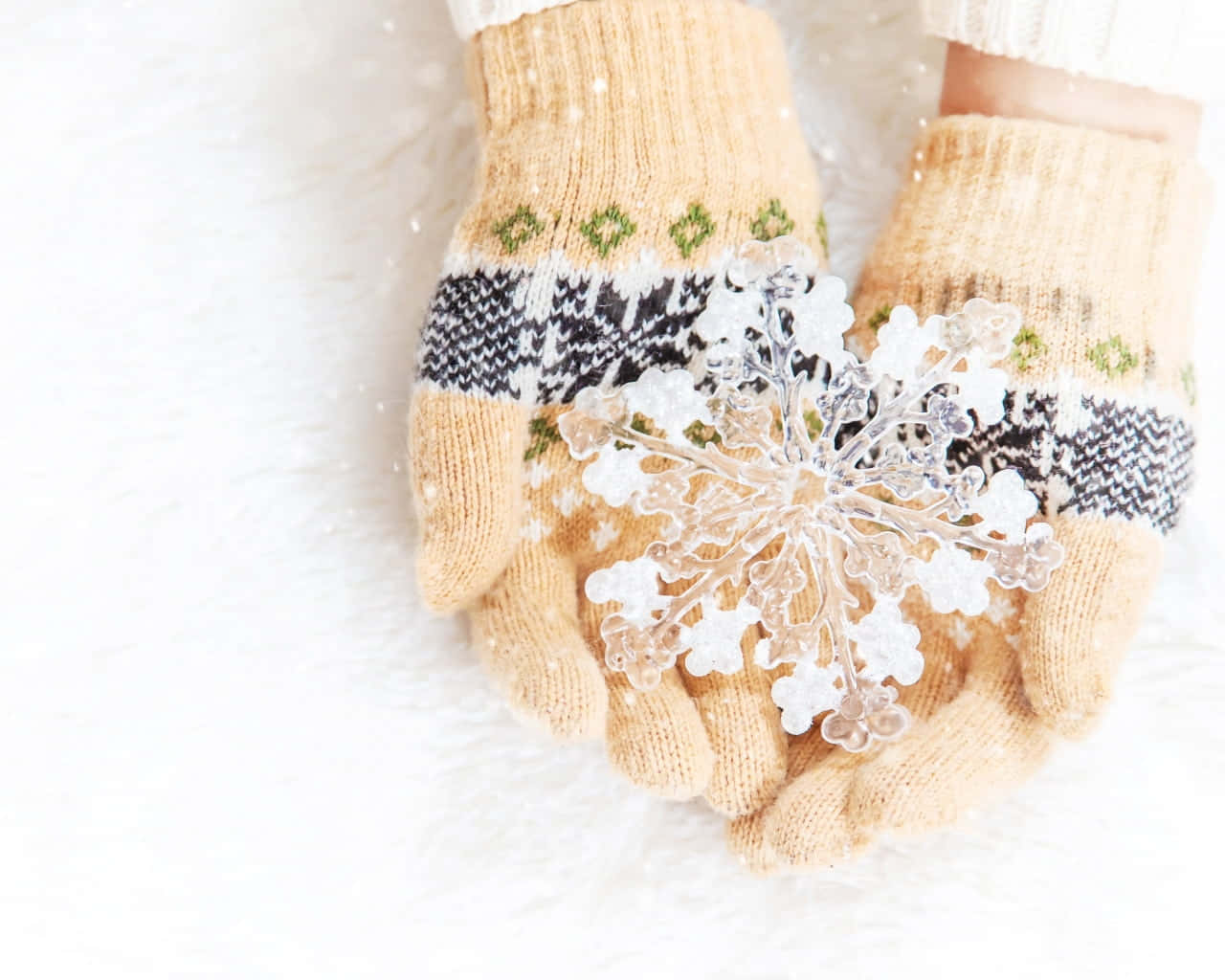 A Pair of Cozy Knitted Mittens Wallpaper