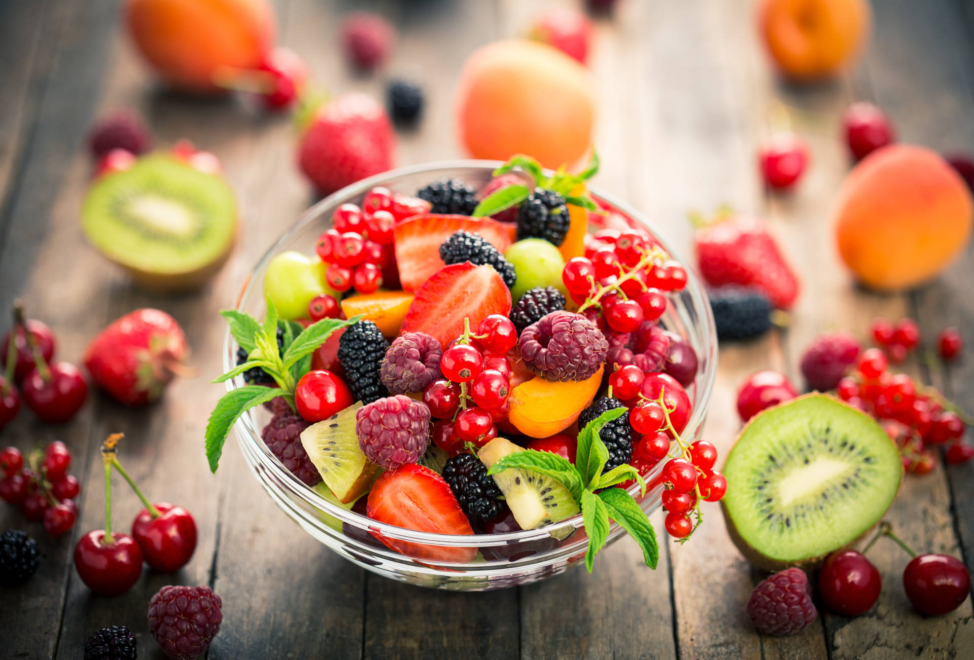 Mixed Fruits And Berries In Glass Bowl Wallpaper
