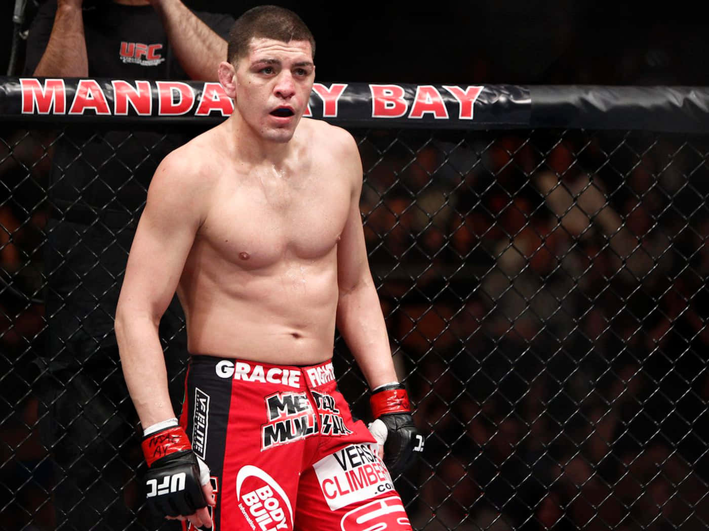 Mixed Martial Artist Nick Diaz In The Middle Of A Fight Wallpaper