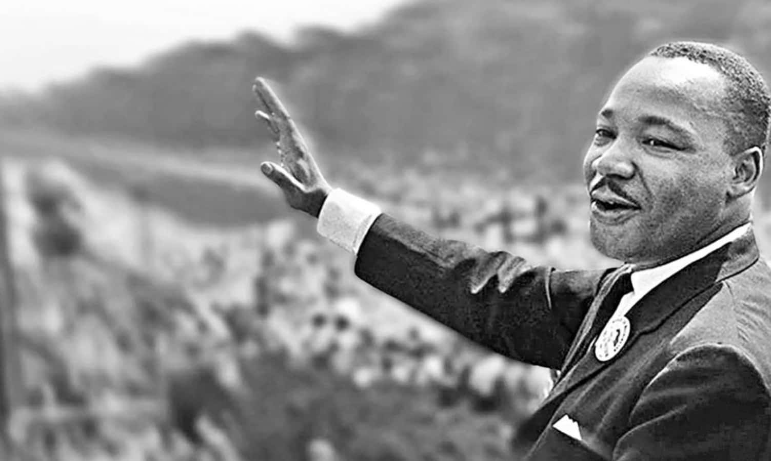 "Dr. Martin Luther King Jr. standing for racial justice and equality."