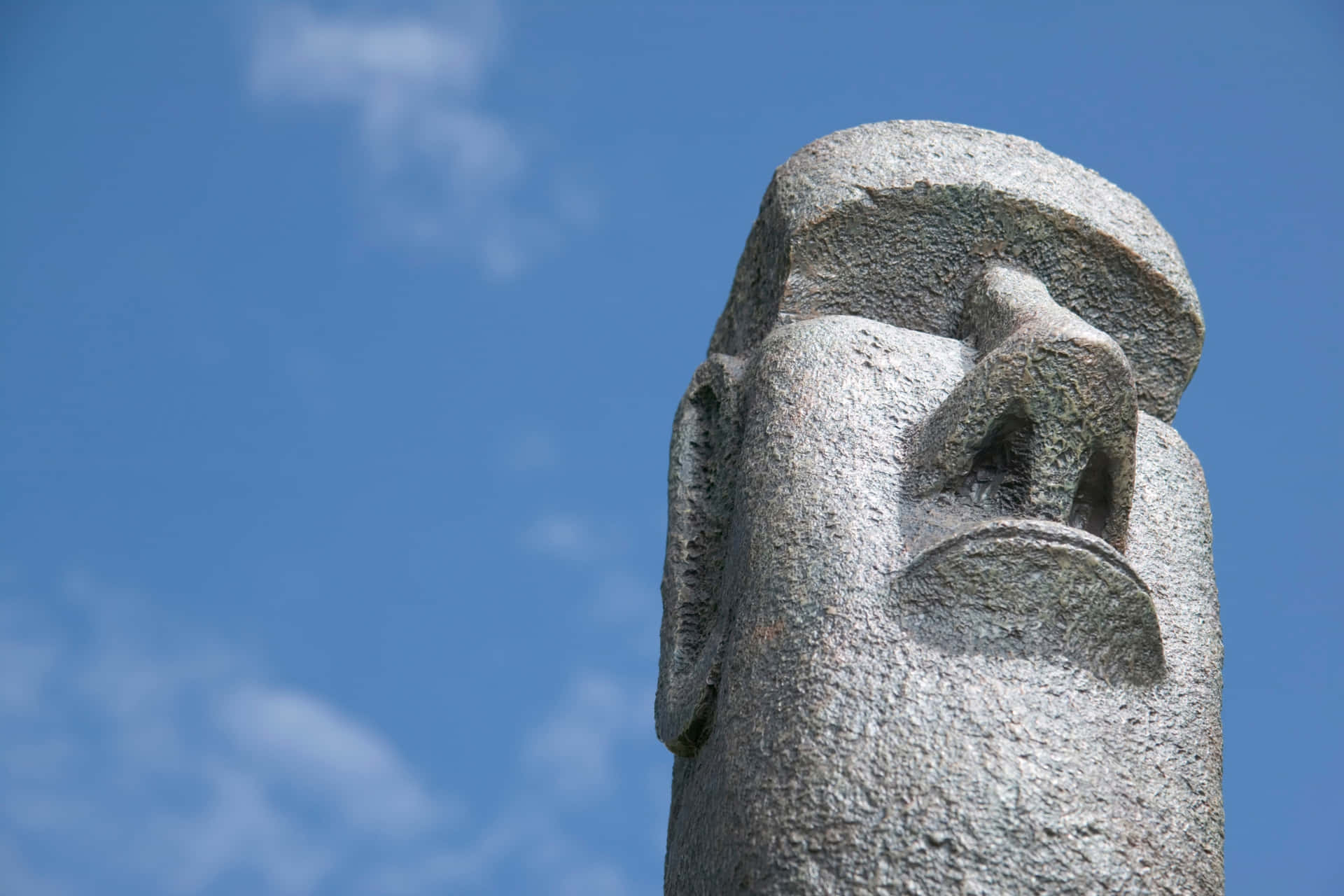 Moai Statue Against Blue Sky Wallpaper