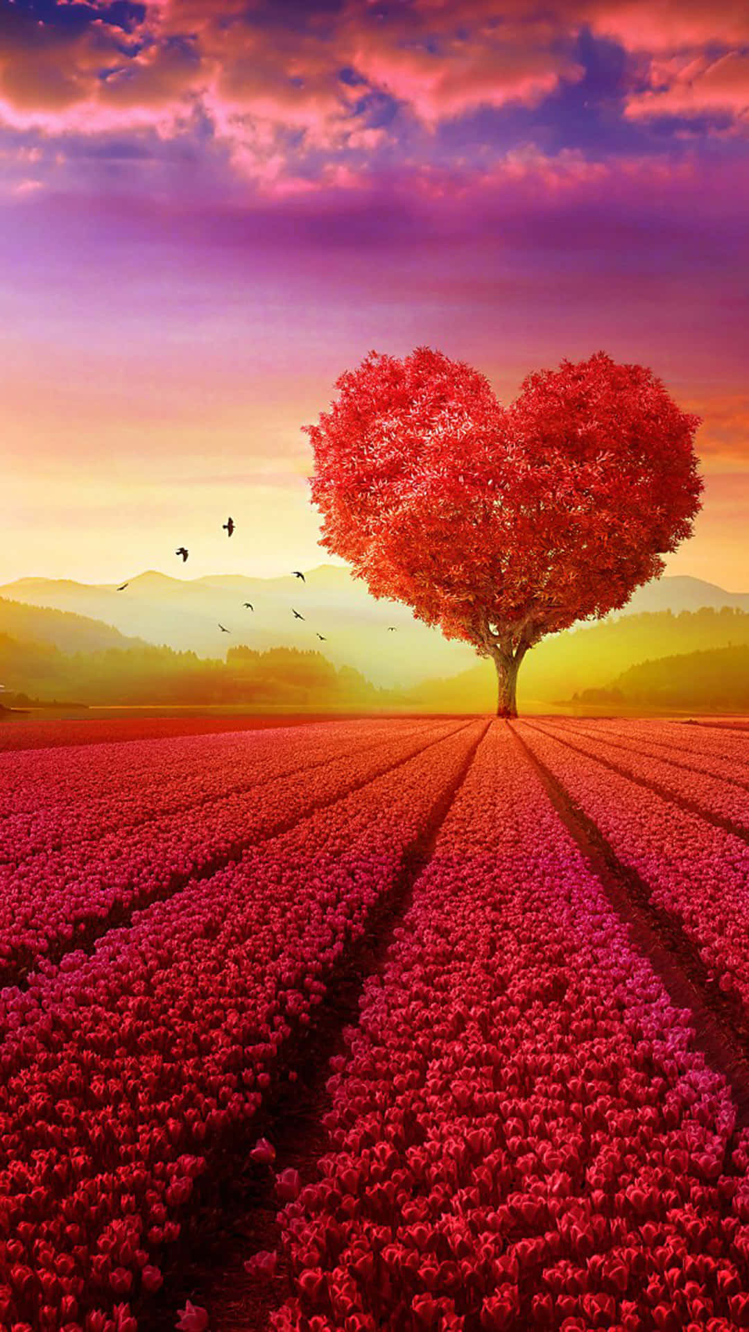 A Red Heart Shaped Tree In A Field Of Flowers