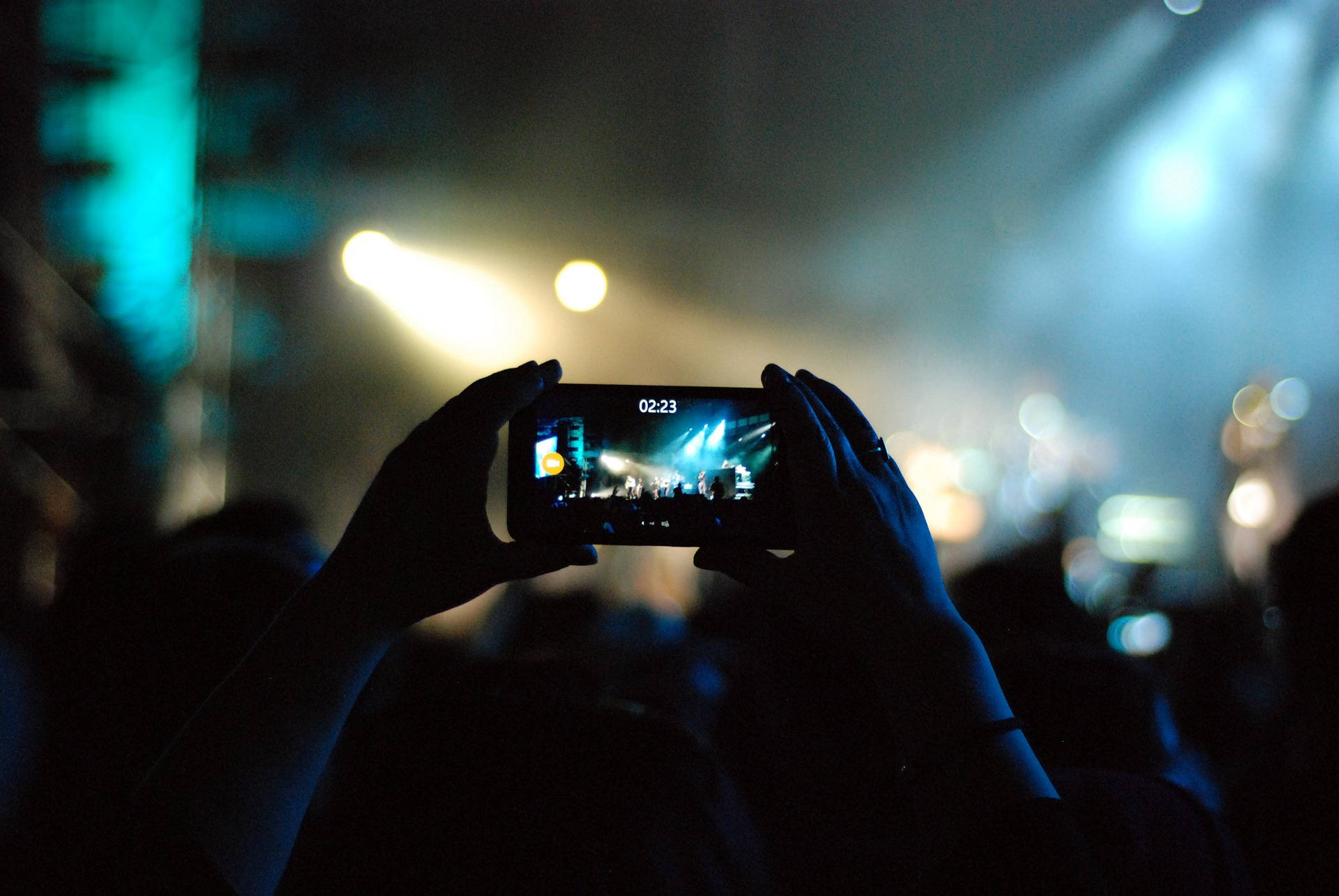 Mobile Phone Capturing Concert Moments Background