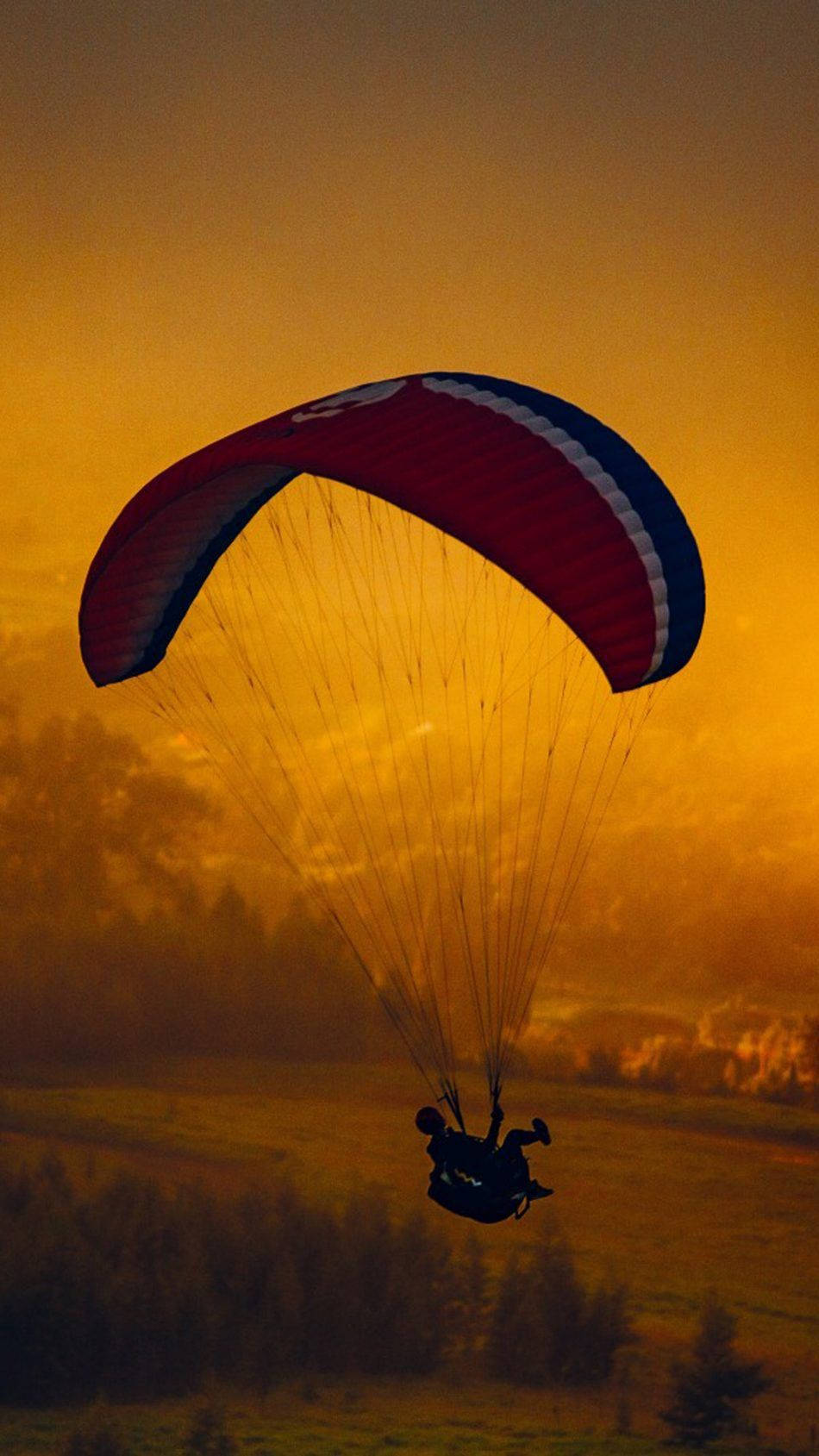 Mobilesonnenuntergang Paragliding Wallpaper