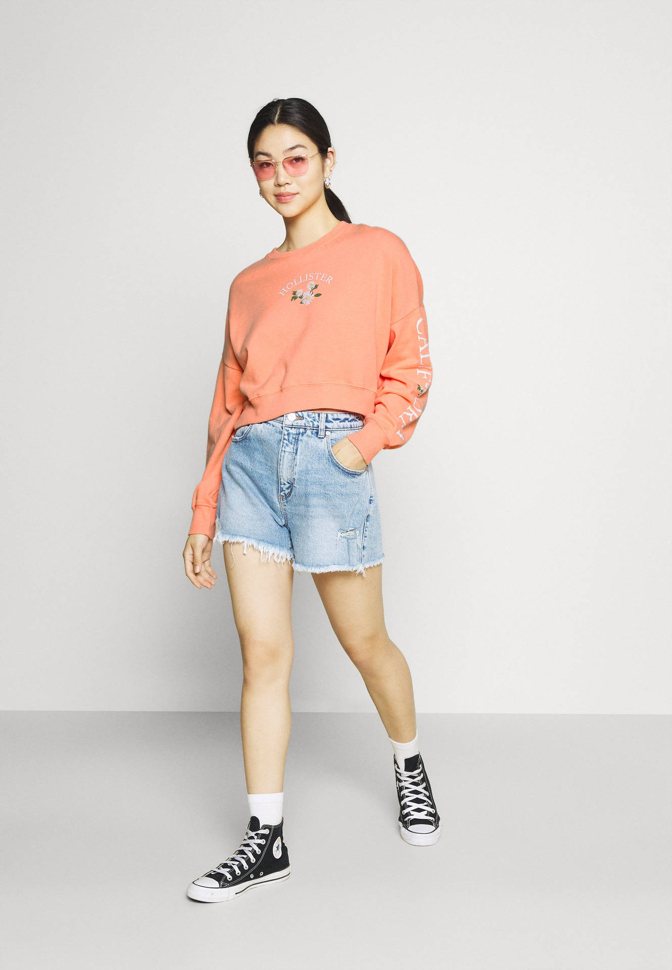 Model In Peach Hollister Sweatshirt Wallpaper