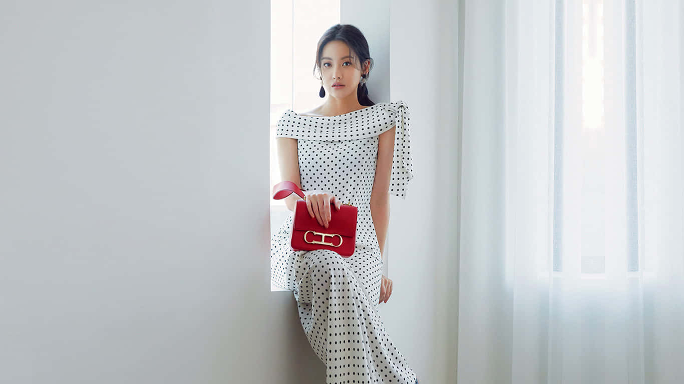 Model Wearing Modest Polka Dot Dress Wallpaper