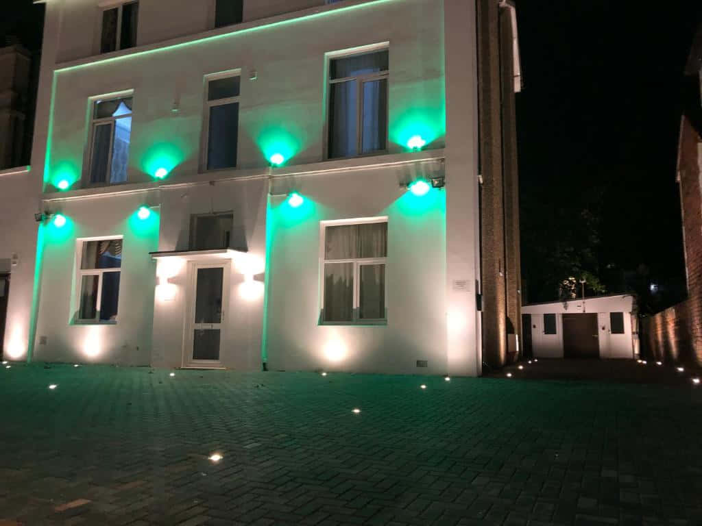 Modern Building Green Lights Night Wallpaper