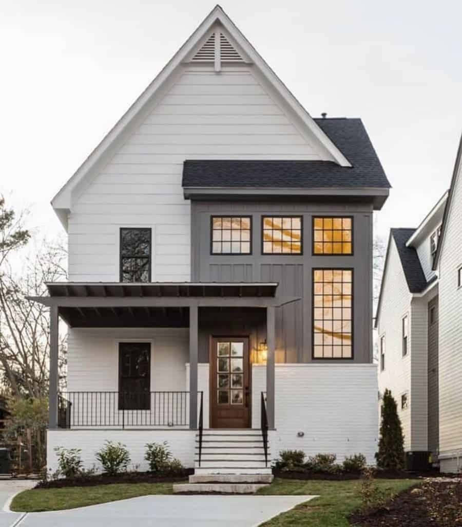A White And Gray Home With A Front Porch