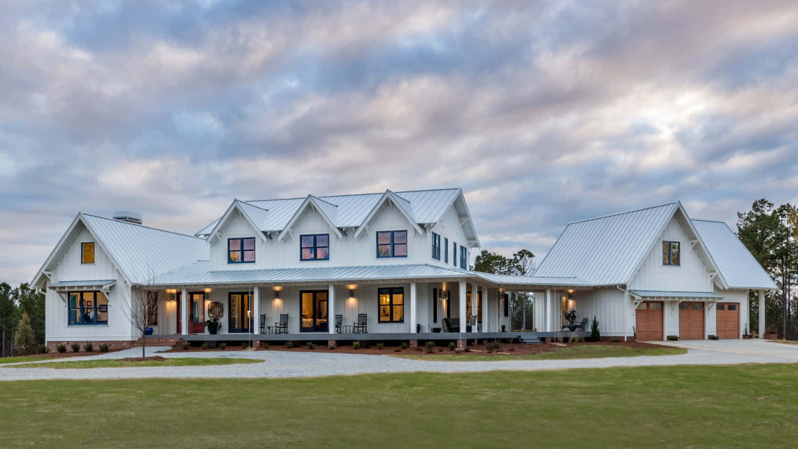 A White Farmhouse With A Large Front Porch