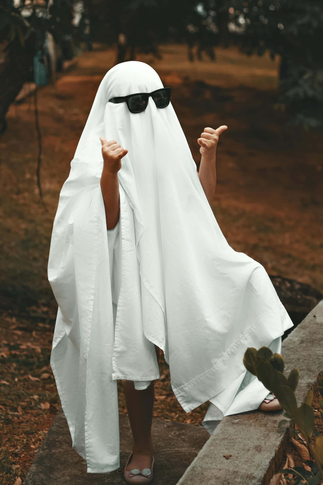 Modern Ghost Costume Outdoors Thumbs Up Wallpaper