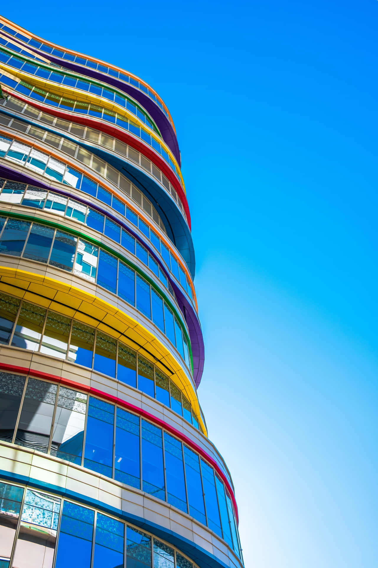 A Building With Colorful Windows Wallpaper