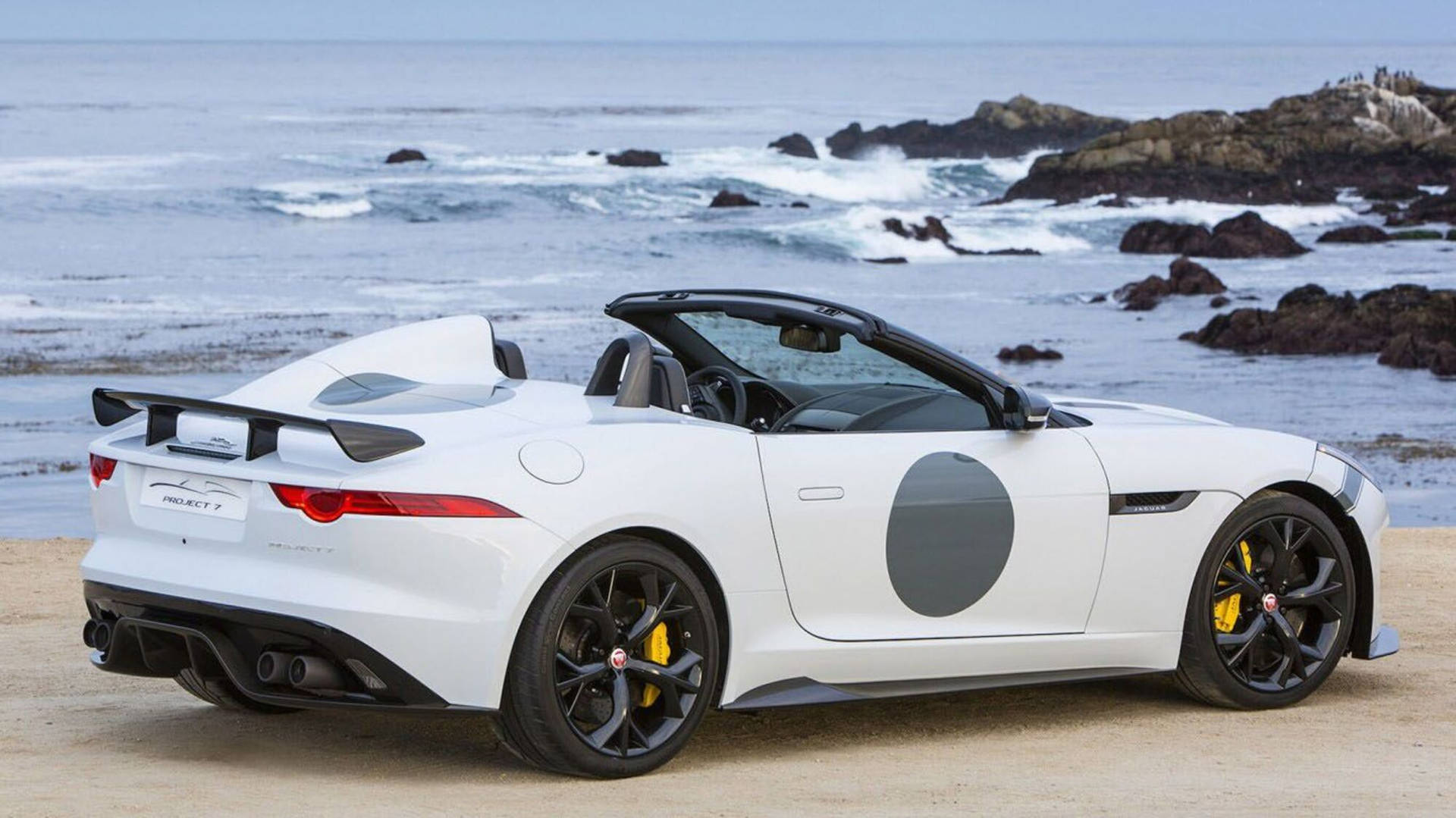 Luxurious Modern Jaguar Car on a Beach Wallpaper