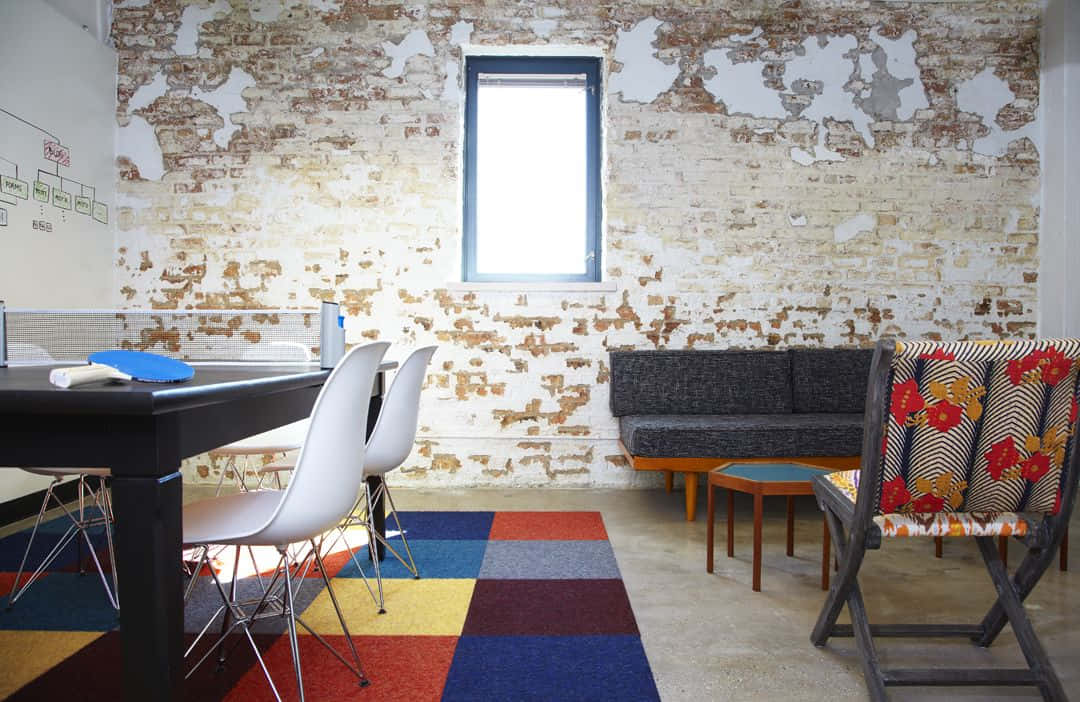 Modern Office Spacewith Exposed Brick Wall Wallpaper