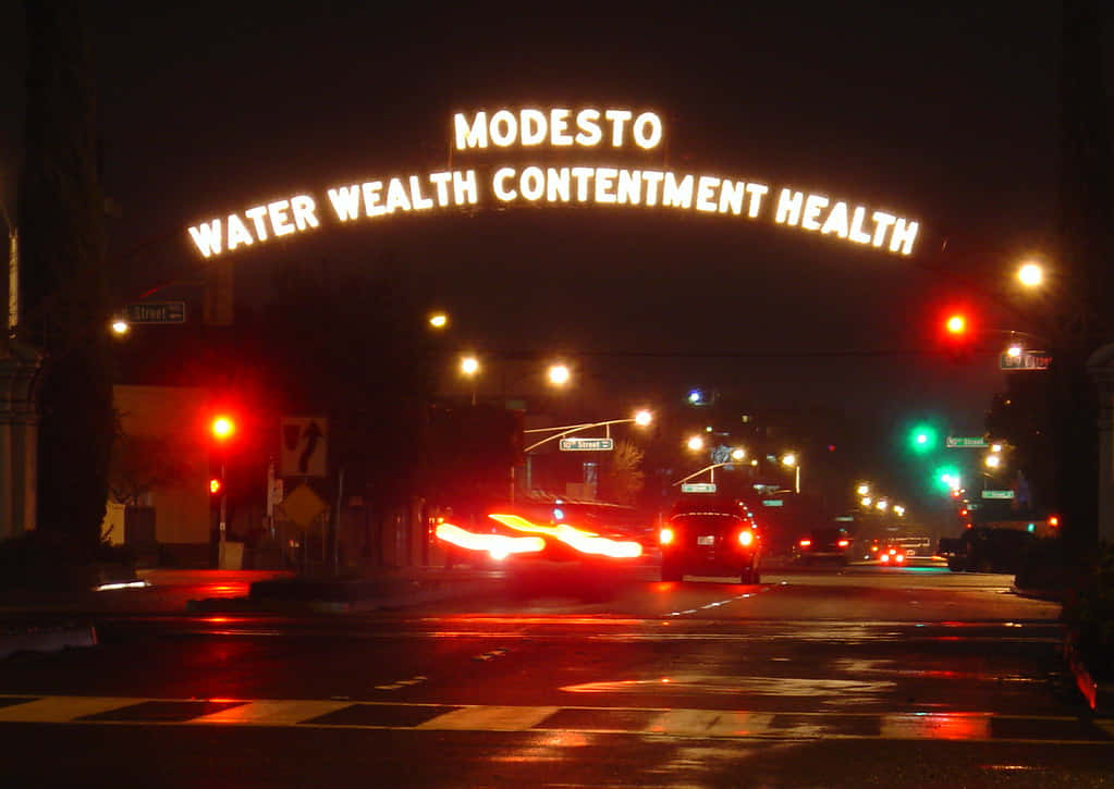 Modesto Arch Nighttime Street Scene Wallpaper