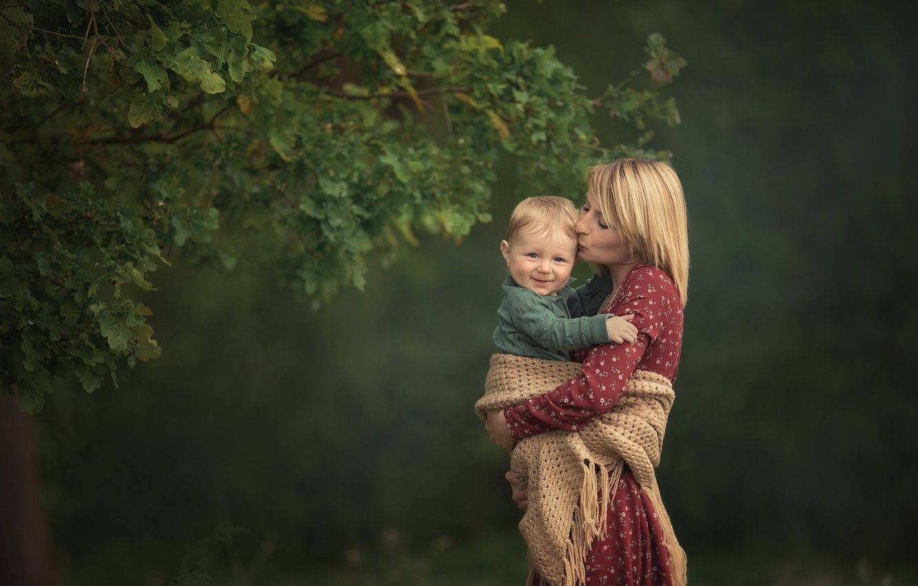 Mom And Son Beside Tree Wallpaper