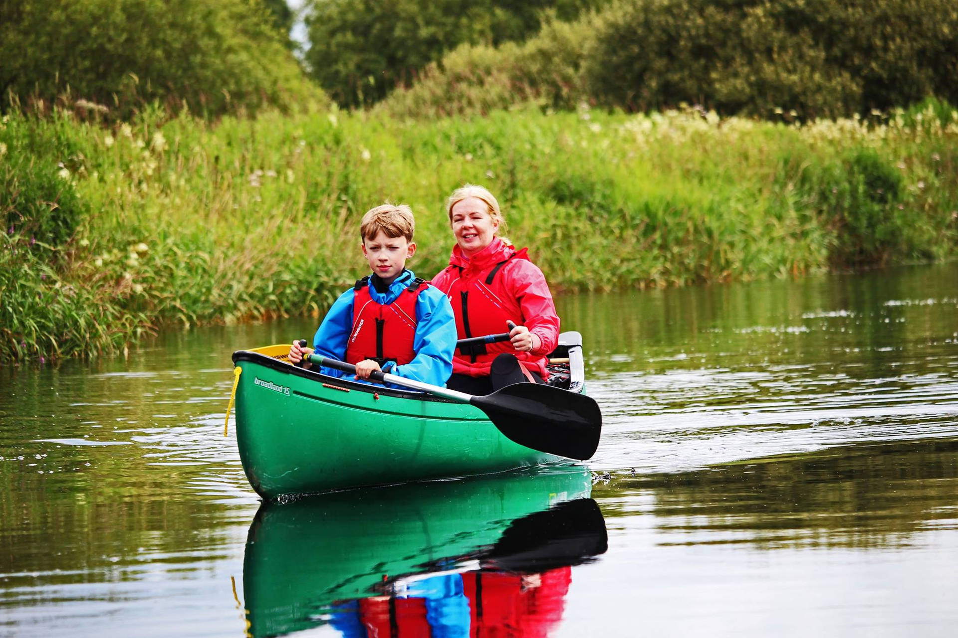 Mom Canoeing With Son Wallpaper