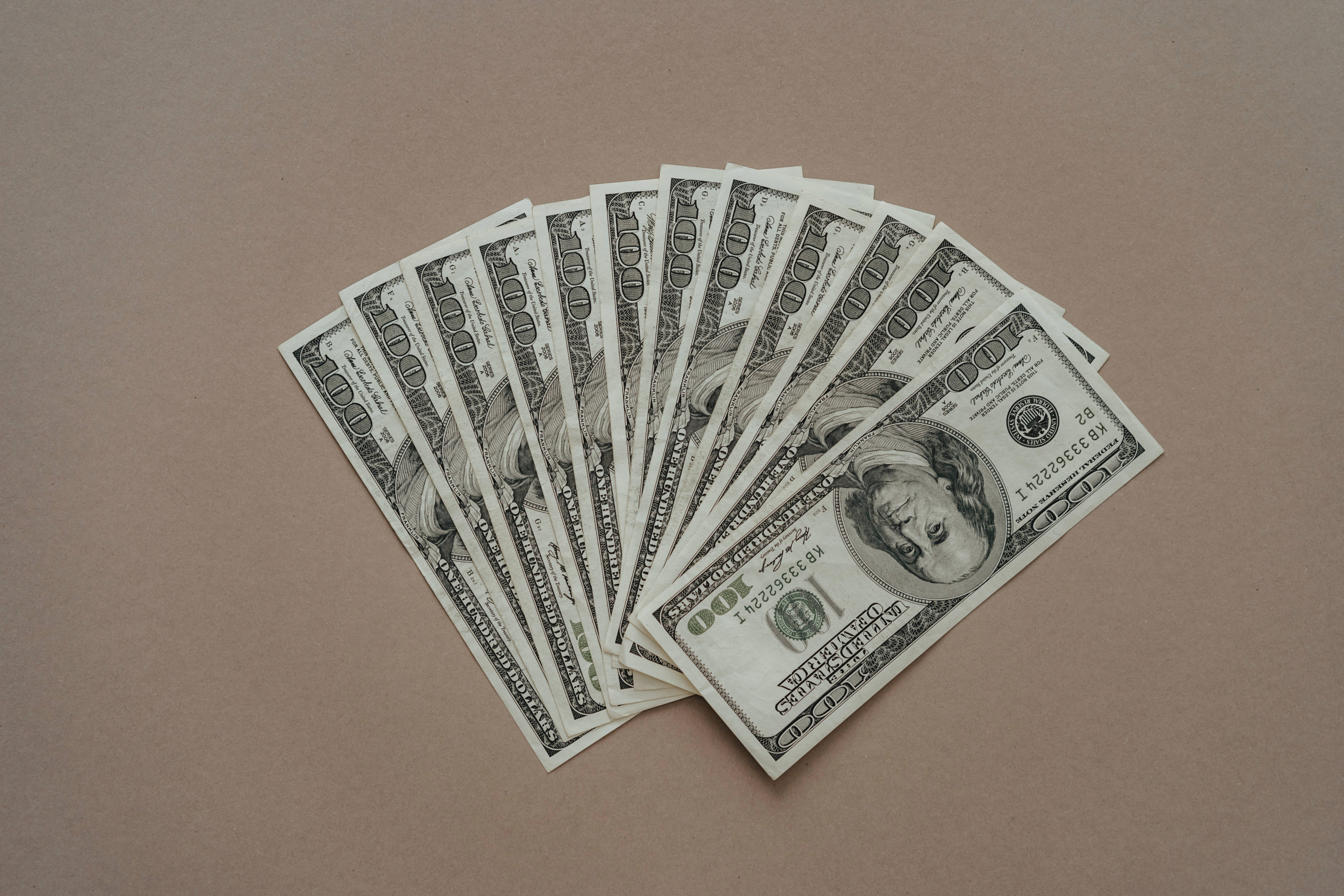 Money Background One Hundred Bills On Brown Background Picture