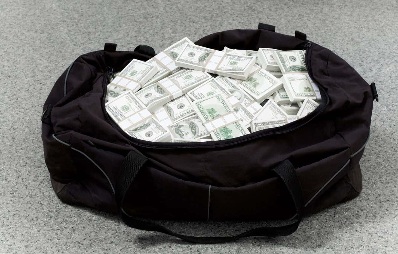 Money Bag Stuffed With Dollar Bills Wallpaper
