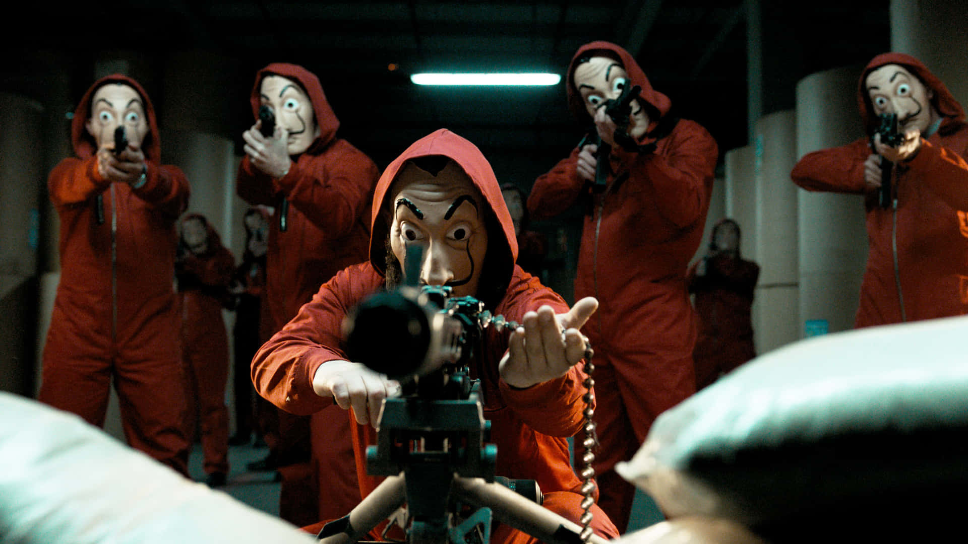 A Group Of People In Red Suits With Guns