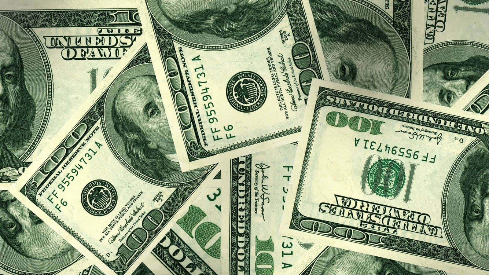 A Pile Of Green Dollar Bills